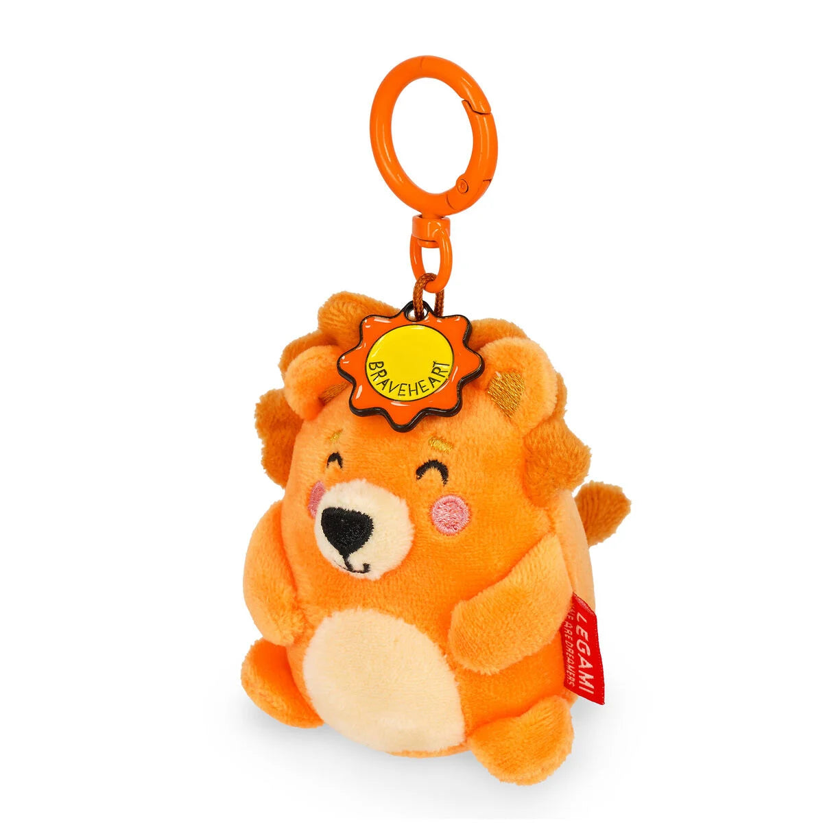 Plush lion keychain with a tag on a white background