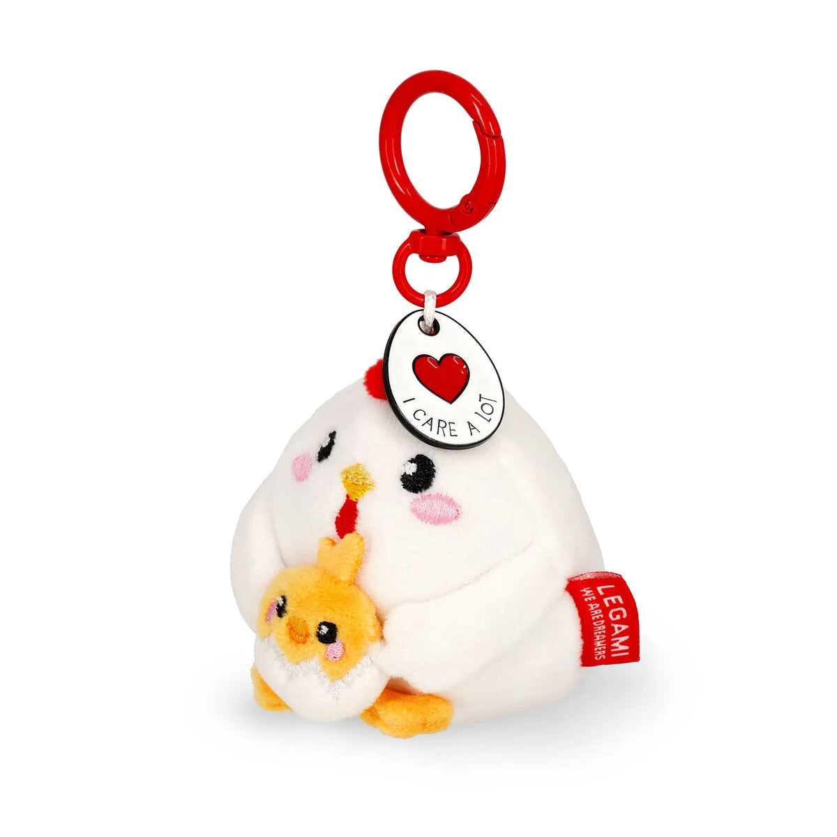 Plush key ring chick in an egg with a red tag and heart symbol on a white background