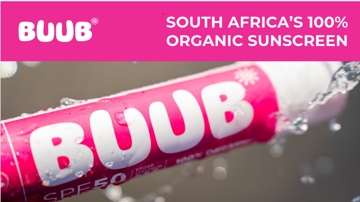 BUUB sunscreen stick with pink packaging and water droplets on a blurred background