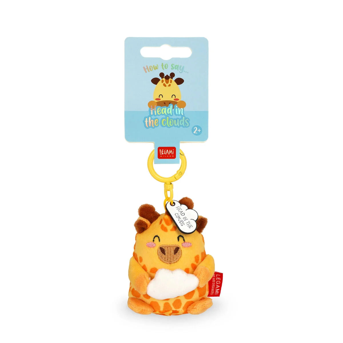 Plush giraffe key ring with a tag on a white background
