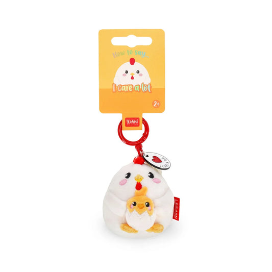 Plush chicken toy with a keychain and tag on a white background