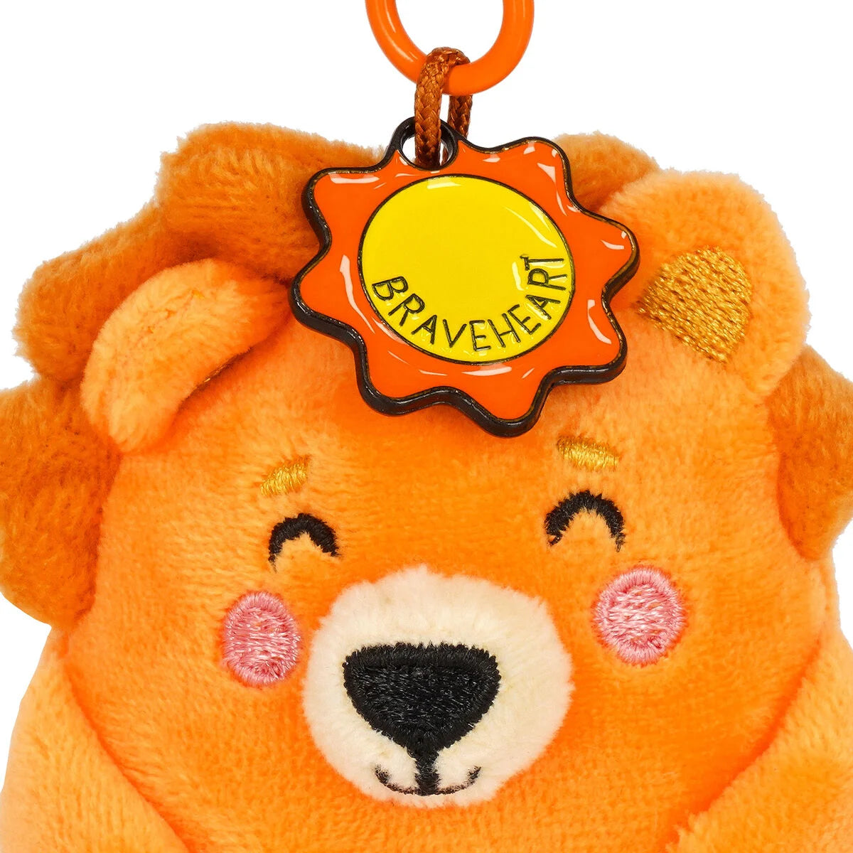 Plush lion keychain with a 'Braveheart' tag on a white background