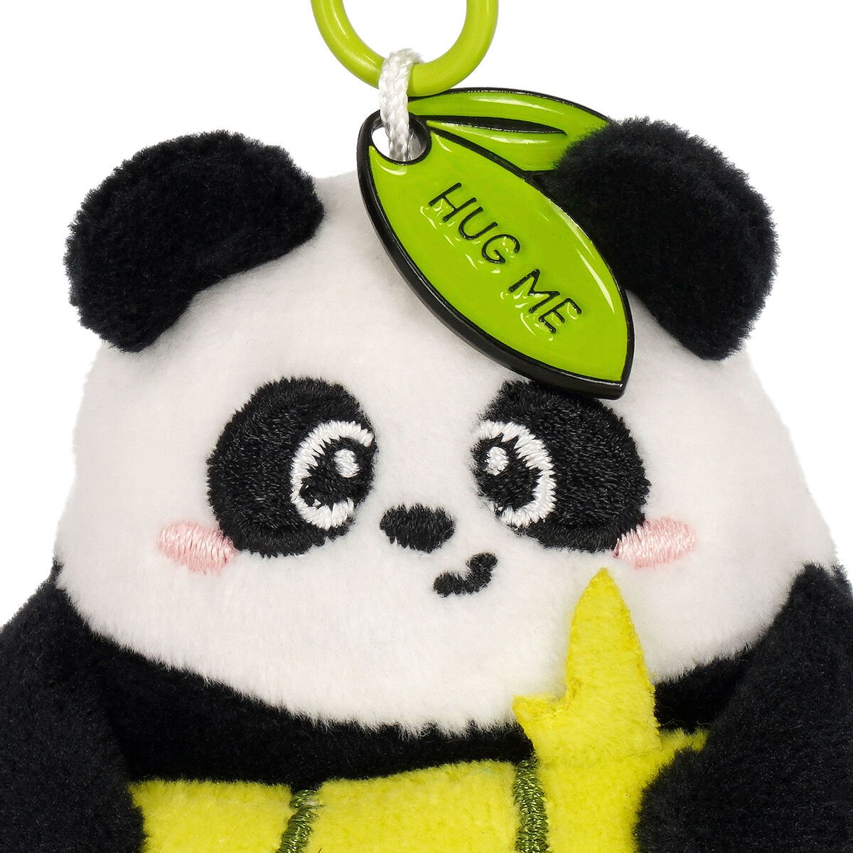Plush panda key ring with a 'Hug Me' tag on a white background